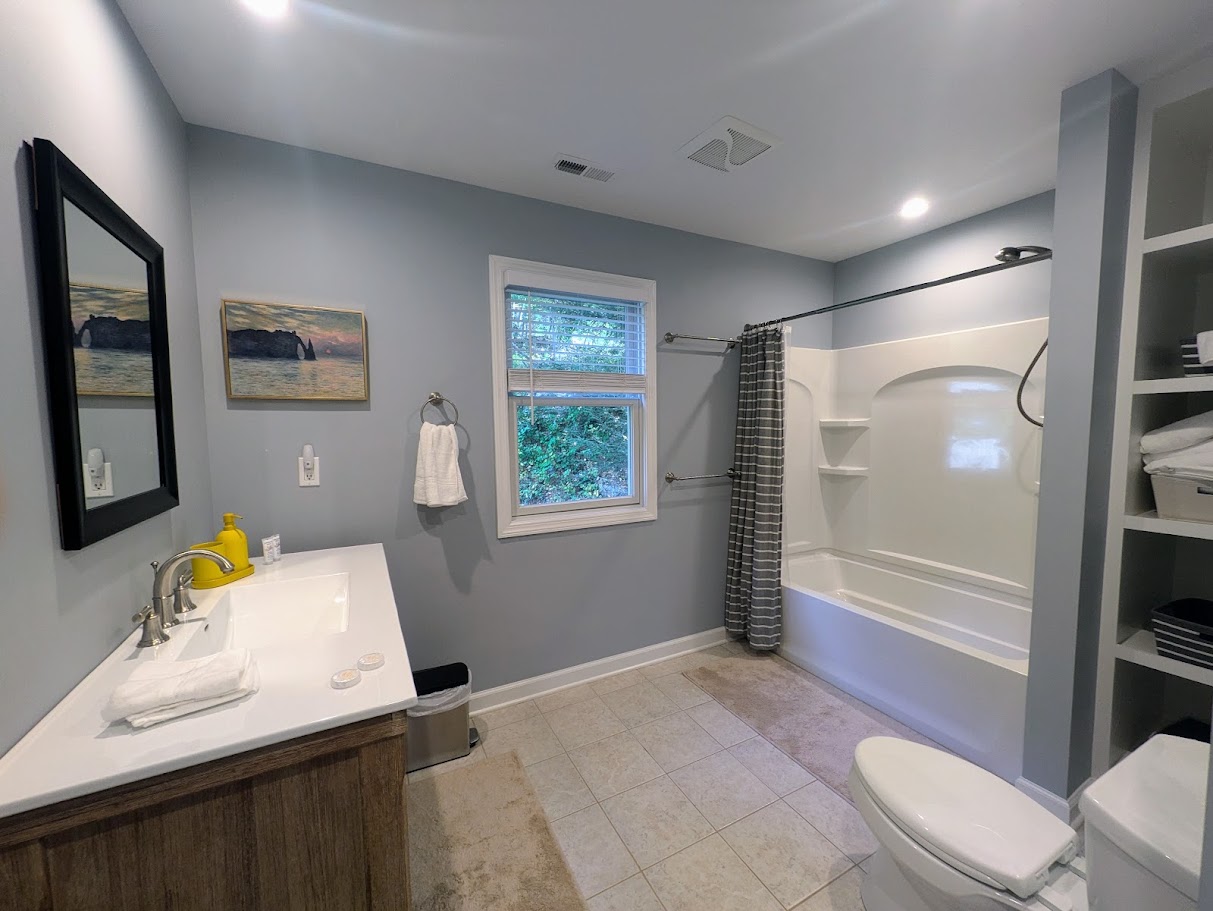Upstairs bathroom with bathtub and shower